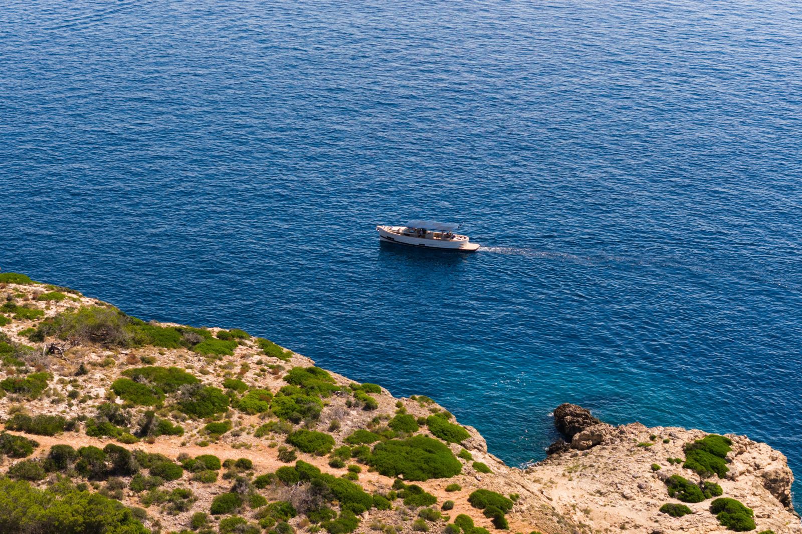 The SAMAR 50 off a rocky headland, aerial view