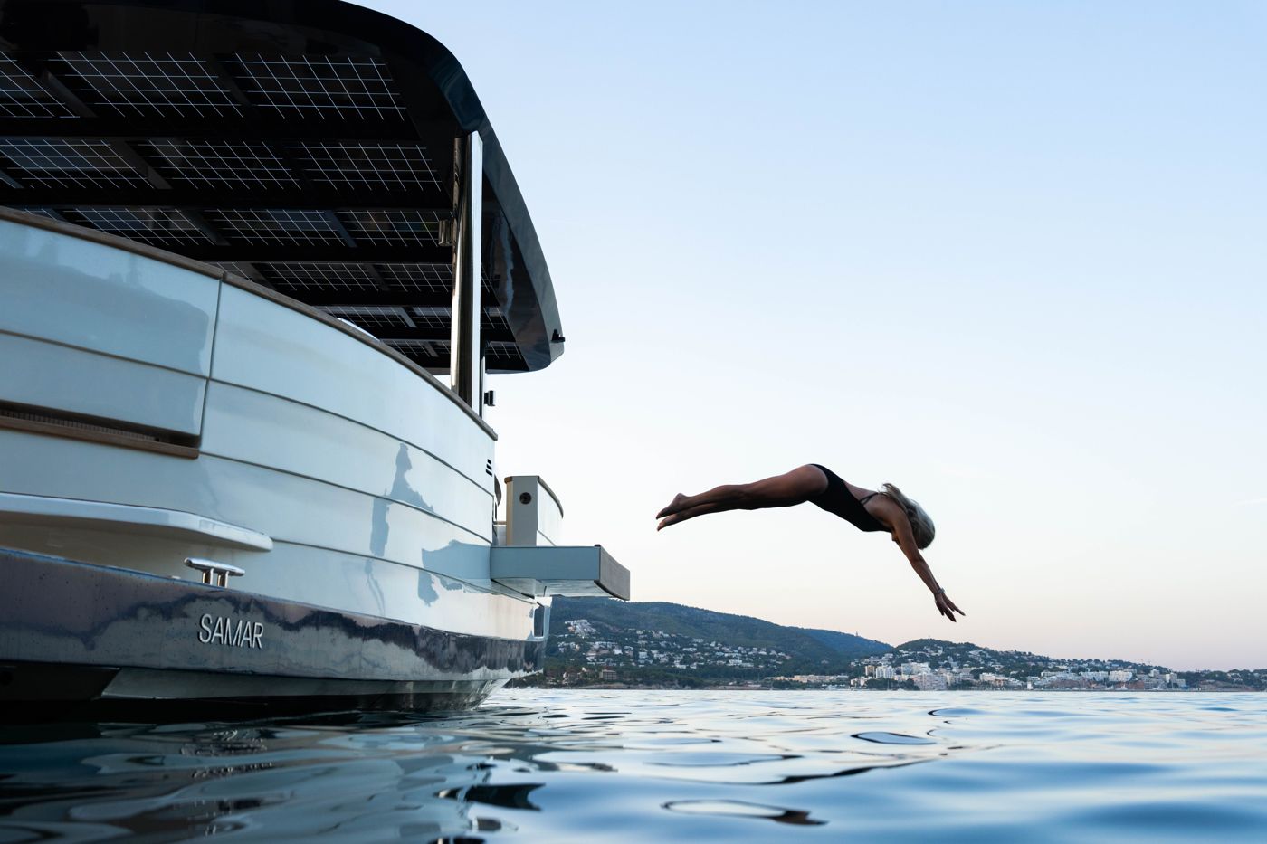 A guest diving from the side of the SAMAR 50