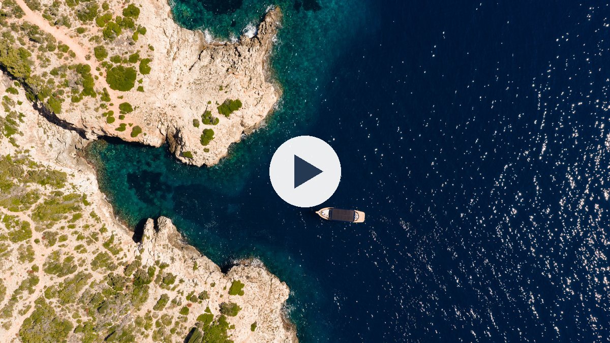 Aerial view of the SAMAR 50 off the Mallorcan coast, with a play button